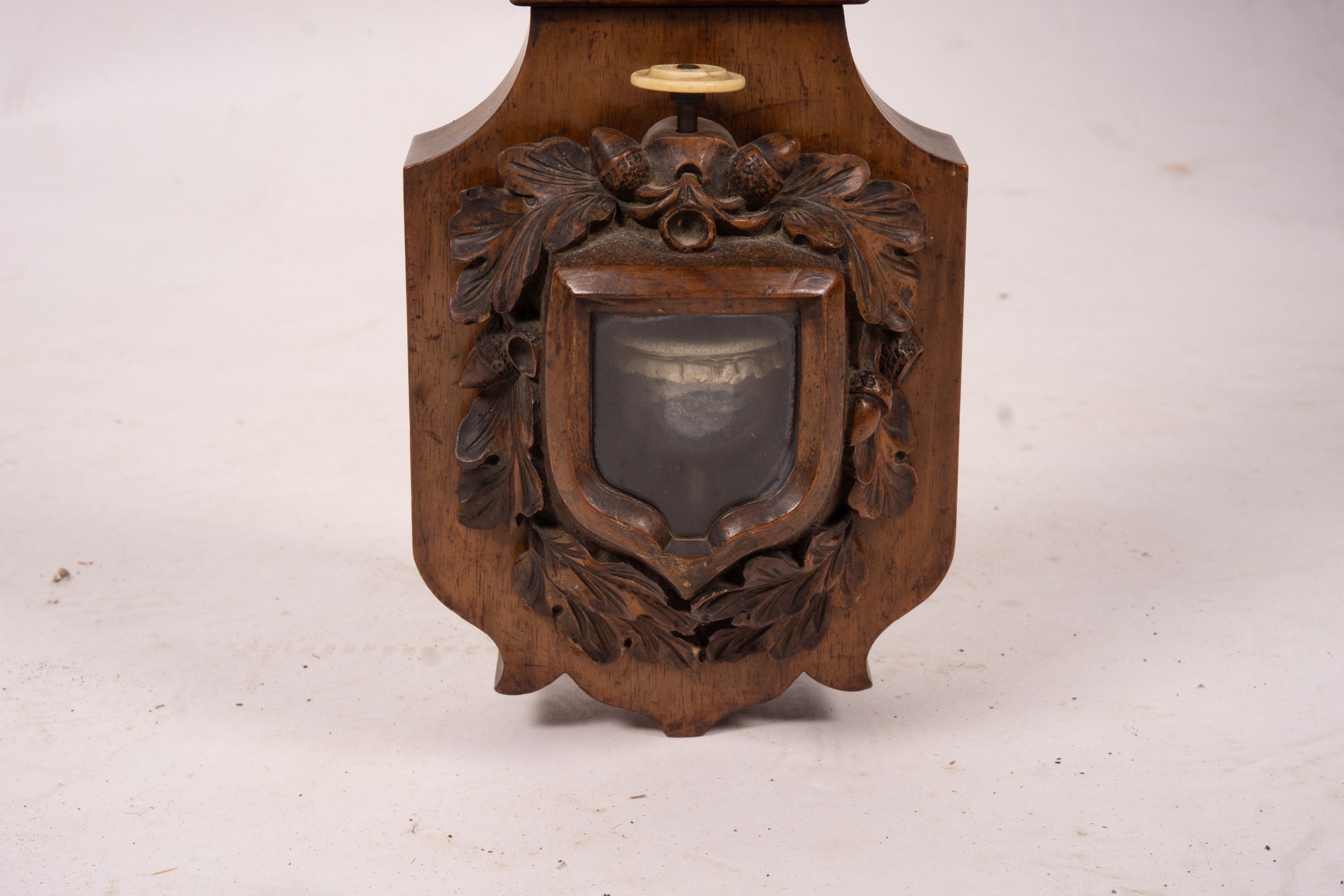 A Victorian carved walnut stick barometer by Chadburn Bros., Sheffield, height 104cm